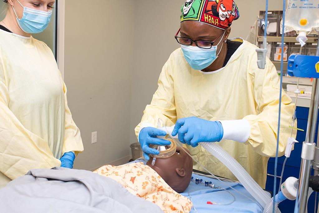 A U N E D N P student practices on a patient simulator